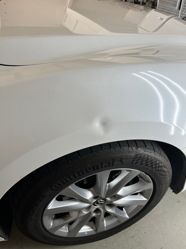 car panel with a dent